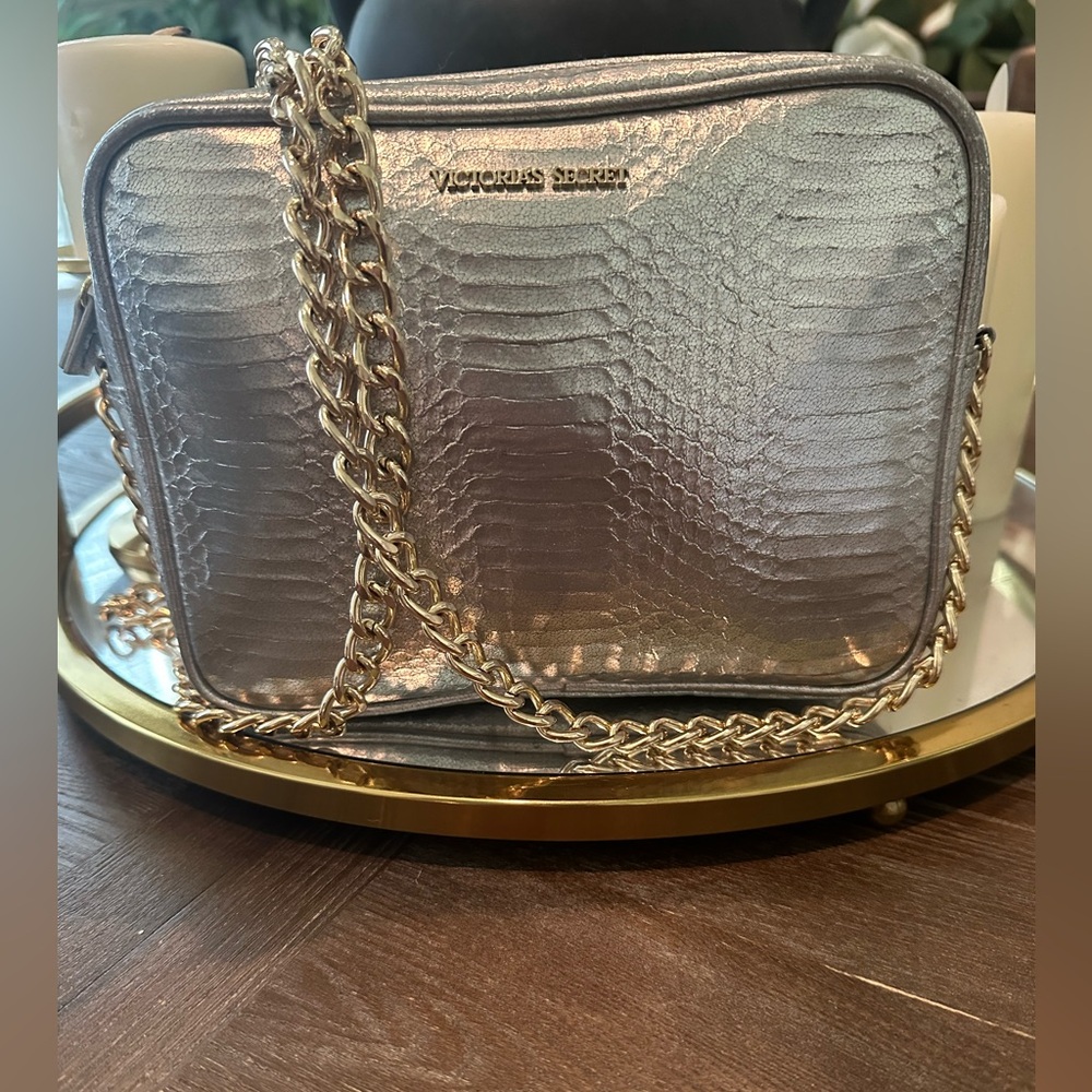 Very Pretty Vitoria Secret Cross Body Purses Is Silver With Havy Gold Chain.